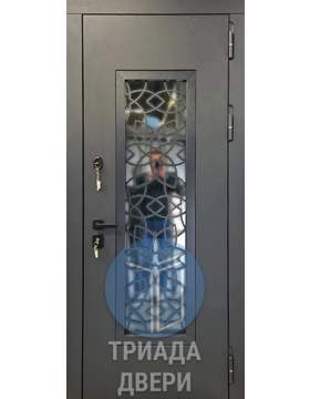 металлическая наружная дверь с ковкой и стеклом