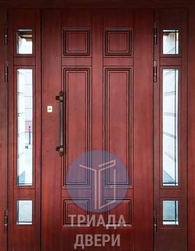 двустворчатая металлическая дверь с боковыми вставками и стеклом в дом